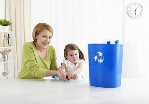Recycling bins and sorted materials at a London transfer station