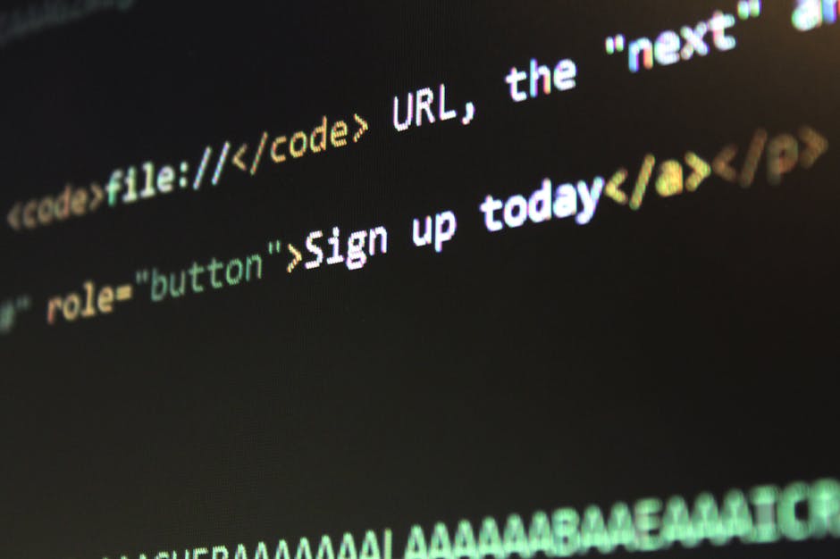A close-up of a computer screen displaying black background with lines of colorful HTML code, including tags such as <code>, <img>, and <button>, along with visible green and white t
